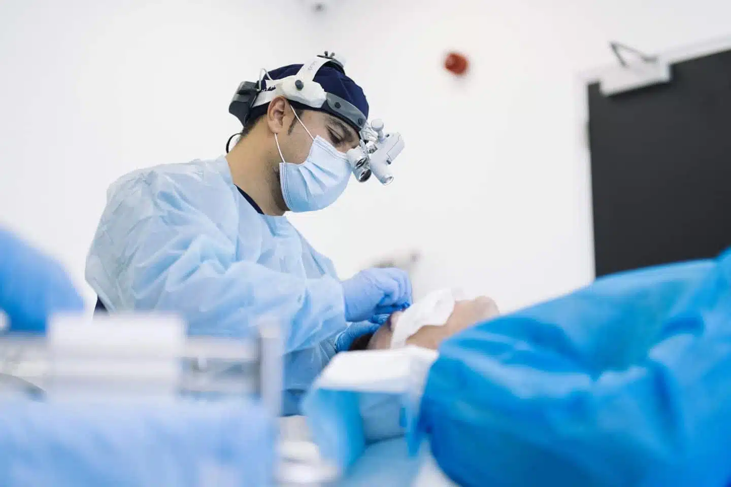 Doctor examining patient for facial transplant